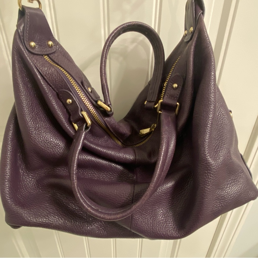 Used plum colored Ora Delphine purse